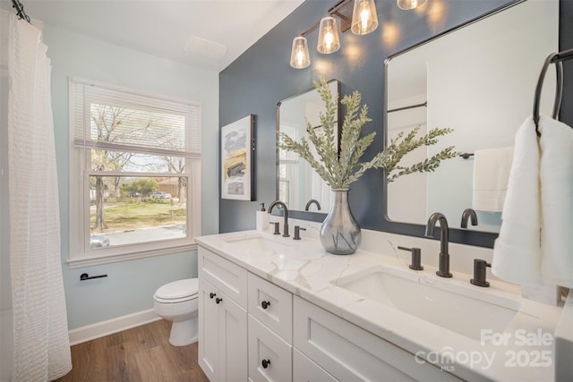 8025 Cliffside Dr, Charlotte, NC 28270 - full bathroom with double vanity, wood finished floors, and a shower with curtain
