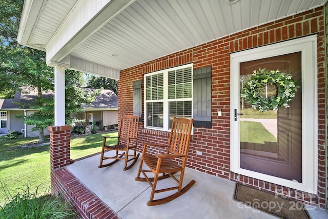 224 Eagle Creek Rd, Clover, SC 29710 - property entrance featuring covered porch, brick siding, and a lawn