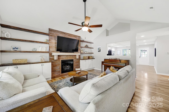 224 Eagle Creek Rd, Clover, SC 29710 - living room with ceiling fan, light wood-style flooring, lofted ceiling, a large fireplace, and recessed lighting