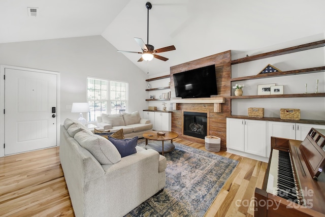 224 Eagle Creek Rd, Clover, SC 29710 - living area featuring ceiling fan, light wood-style flooring, a fireplace, and high vaulted ceiling