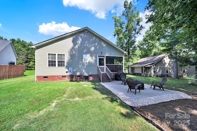 224 Eagle Creek Rd, Clover, SC 29710 - rear view of property featuring crawl space, a patio, a sunroom, a yard, and a fire pit