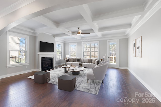 704 Kenway Loop, Mooresville, NC 28117 - living room featuring a glass covered fireplace, dark wood-type flooring, beam ceiling, a ceiling fan, and coffered ceiling