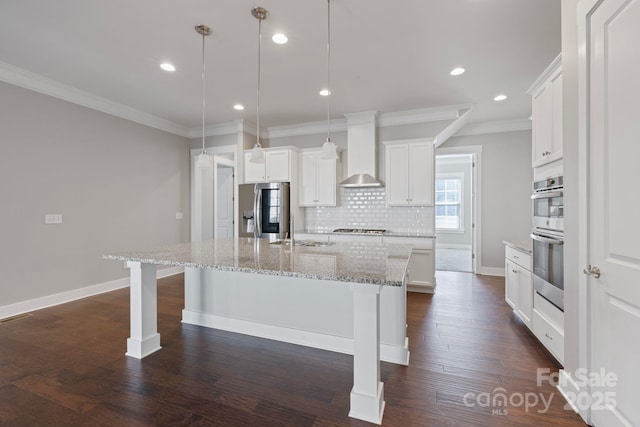 704 Kenway Loop, Mooresville, NC 28117 - kitchen with stainless steel appliances, wall chimney range hood, crown molding, an island with sink, and tasteful backsplash