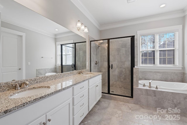 704 Kenway Loop, Mooresville, NC 28117 - full bath featuring tiled tub, double vanity, a stall shower, ornamental molding, and recessed lighting