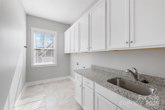 704 Kenway Loop, Mooresville, NC 28117 - laundry room featuring hookup for an electric dryer, hookup for a washing machine, and cabinet space