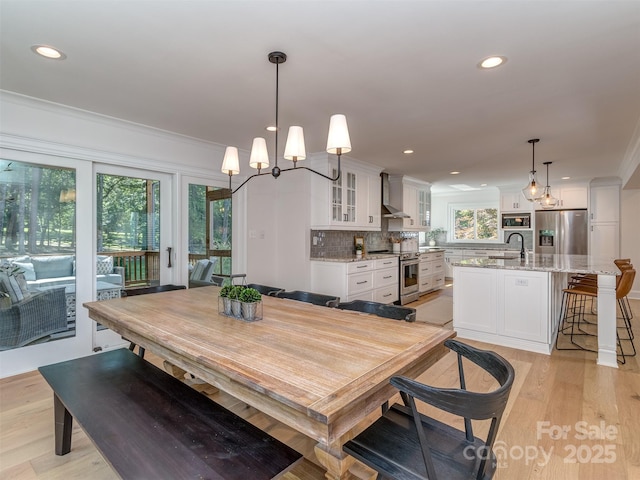 202 Walden Ln, Weddington, NC 28104 - dining room featuring ornamental molding, recessed lighting, a chandelier, and light wood-type flooring