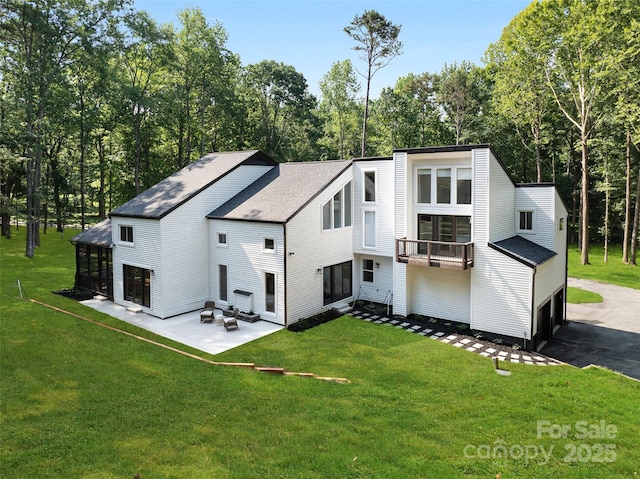 202 Walden Ln, Weddington, NC 28104 - view of side of property with driveway, a balcony, a lawn, and a patio