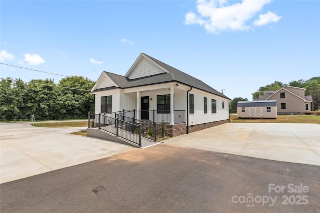 3511 Warlicks Church Rd, Connelly Springs, NC 28612 - modern inspired farmhouse with covered porch, driveway, a shingled roof, and crawl space
