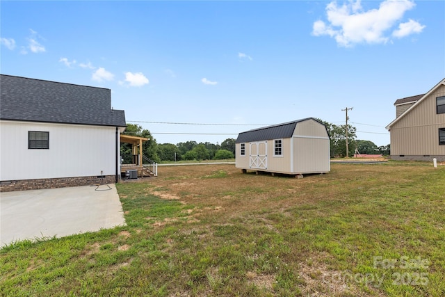 3511 Warlicks Church Rd, Connelly Springs, NC 28612 - view of green lawn featuring a storage unit and a patio