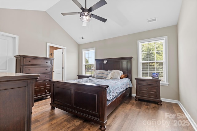 3511 Warlicks Church Rd, Connelly Springs, NC 28612 - bedroom featuring multiple windows, dark wood-type flooring, lofted ceiling, and ceiling fan