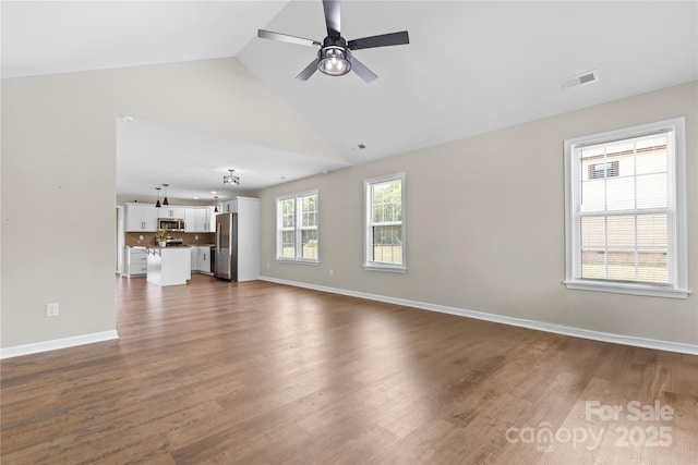 3511 Warlicks Church Rd, Connelly Springs, NC 28612 - unfurnished living room with a ceiling fan, dark wood-type flooring, and high vaulted ceiling