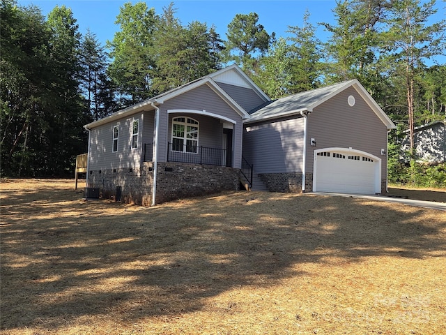 153 Brook Creek Dr, Troutman, NC 28166 - view of front of house featuring covered porch, a garage, and dirt driveway