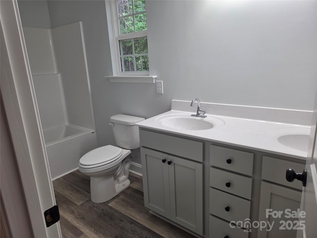 153 Brook Creek Dr, Troutman, NC 28166 - bathroom featuring double vanity, wood finished floors, and washtub / shower combination