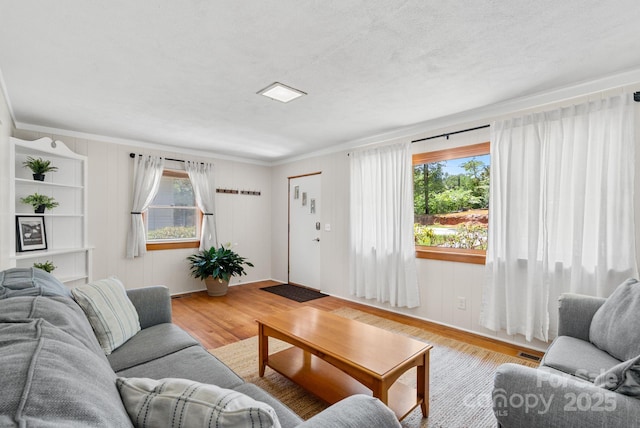 211 Woodland Rd, Tryon, NC 28782 - living room with light wood finished floors and crown molding