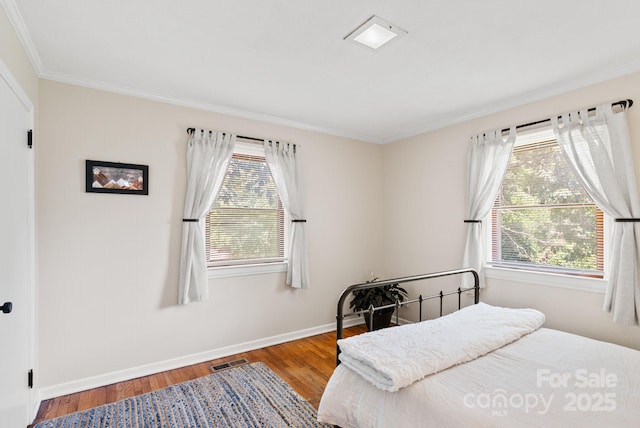 211 Woodland Rd, Tryon, NC 28782 - bedroom with ornamental molding and wood finished floors