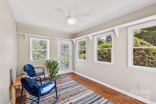 211 Woodland Rd, Tryon, NC 28782 - living area with healthy amount of natural light, wood finished floors, and a ceiling fan