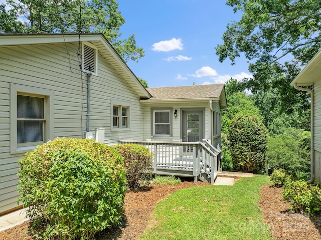 211 Woodland Rd, Tryon, NC 28782 - view of front of house featuring a shingled roof and a front lawn
