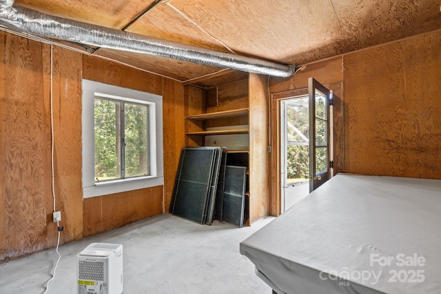 211 Woodland Rd, Tryon, NC 28782 - misc room featuring wood walls and concrete flooring