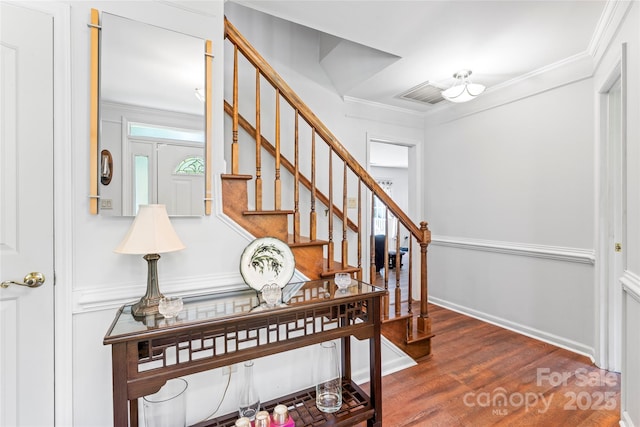 1109 Sunnyview Cir, Matthews, NC 28105 - staircase with ornamental molding and wood finished floors