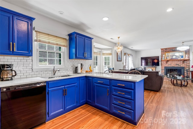 1109 Sunnyview Cir, Matthews, NC 28105 - kitchen featuring black dishwasher, a peninsula, blue cabinetry, light countertops, and recessed lighting