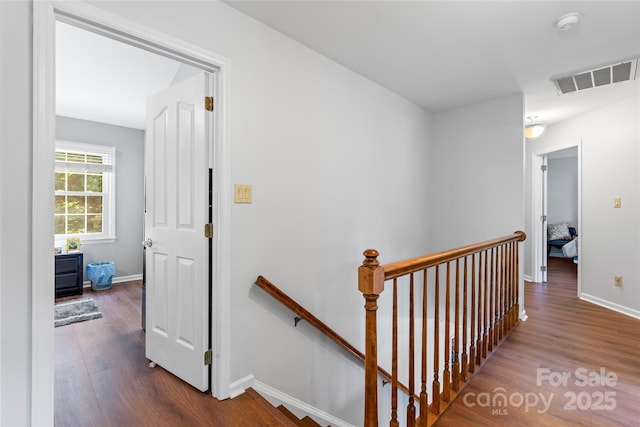 1109 Sunnyview Cir, Matthews, NC 28105 - hall featuring an upstairs landing and dark wood-type flooring