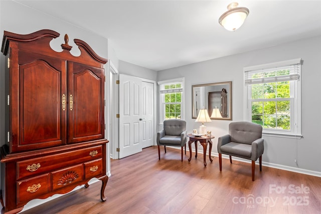 1109 Sunnyview Cir, Matthews, NC 28105 - sitting room with plenty of natural light and wood finished floors