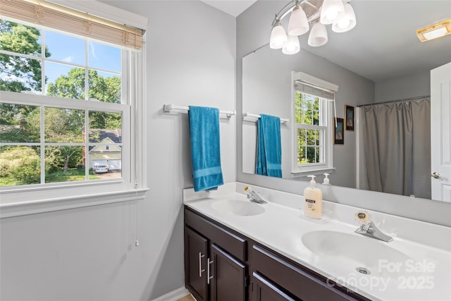 1109 Sunnyview Cir, Matthews, NC 28105 - bathroom with double vanity and a chandelier