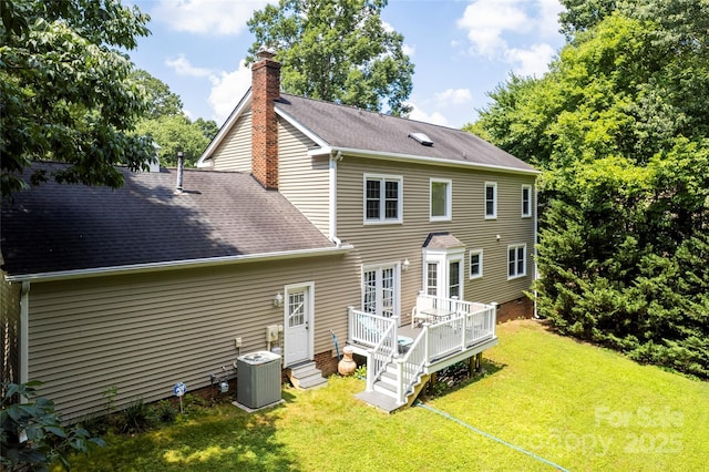 1109 Sunnyview Cir, Matthews, NC 28105 - rear view of house with a wooden deck, a yard, a chimney, and a shingled roof