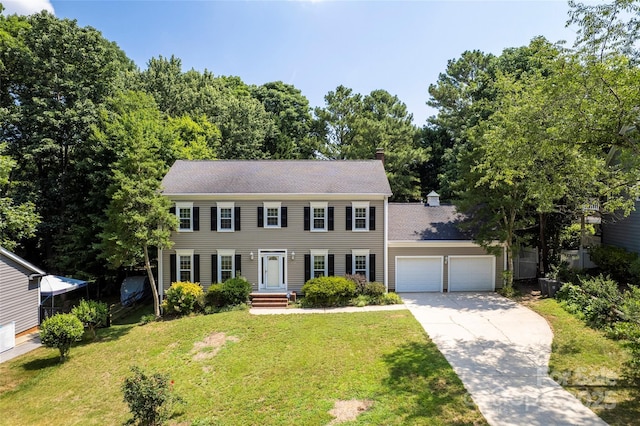 1109 Sunnyview Cir, Matthews, NC 28105 - colonial inspired home with an attached garage, concrete driveway, a front lawn, and a chimney