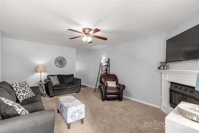2460 Prince Dr, Lancaster, SC 29720 - living room featuring ceiling fan, a fireplace, and carpet