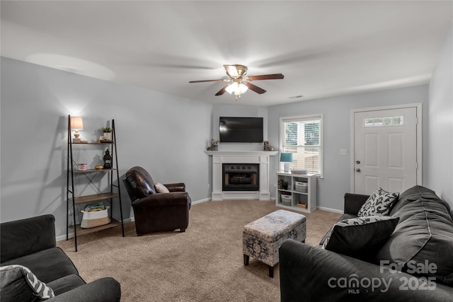 2460 Prince Dr, Lancaster, SC 29720 - carpeted living room with a ceiling fan and a fireplace with raised hearth