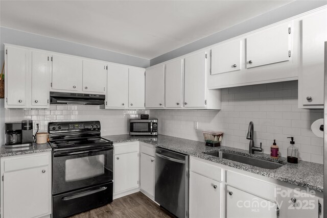 2460 Prince Dr, Lancaster, SC 29720 - kitchen with appliances with stainless steel finishes, under cabinet range hood, backsplash, and white cabinets
