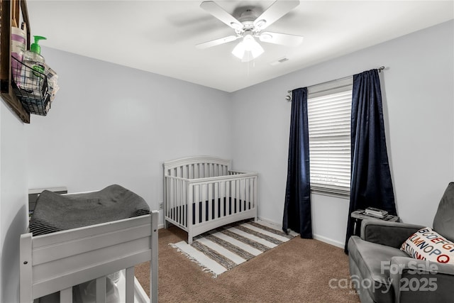 2460 Prince Dr, Lancaster, SC 29720 - carpeted bedroom featuring a nursery area and ceiling fan