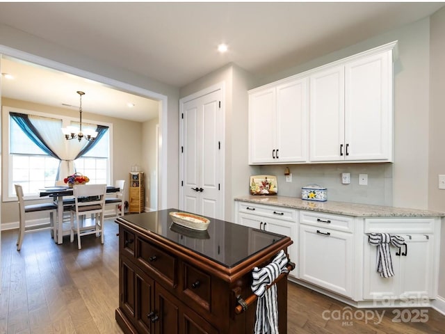 7337 Overjoyed Xing, Charlotte, NC 28215 - kitchen featuring a chandelier, dark wood-style floors, white cabinets, and recessed lighting