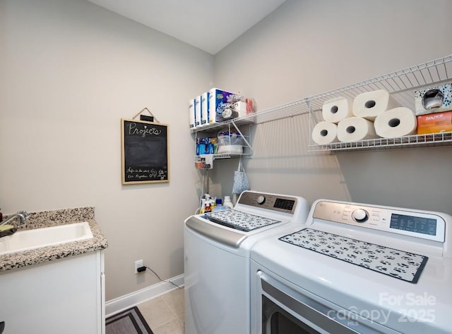 7337 Overjoyed Xing, Charlotte, NC 28215 - laundry area featuring independent washer and dryer, light tile patterned flooring, and cabinet space