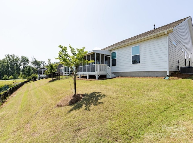 7337 Overjoyed Xing, Charlotte, NC 28215 - rear view of property with a sunroom and a yard
