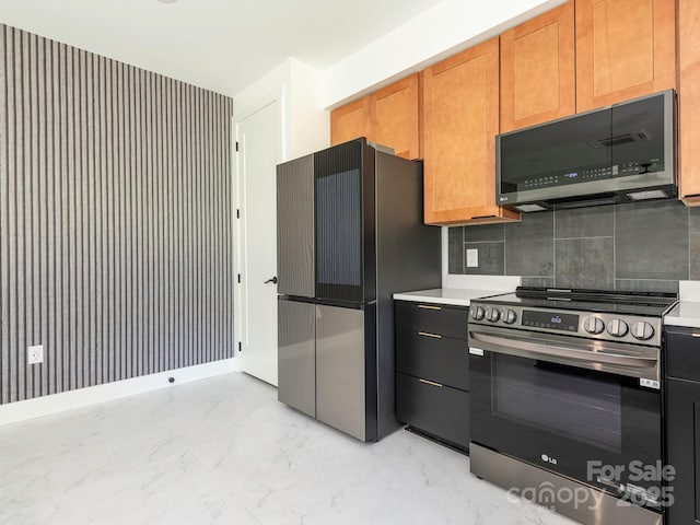6548 Emerald Isle Dr, Sherrills Ford, NC 28673 - kitchen featuring appliances with stainless steel finishes, light marble finish floors, light countertops, and backsplash