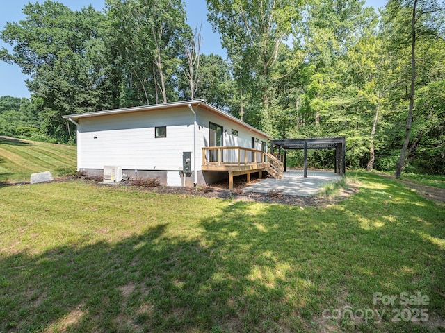 6548 Emerald Isle Dr, Sherrills Ford, NC 28673 - view of home's exterior featuring a wooden deck and a lawn