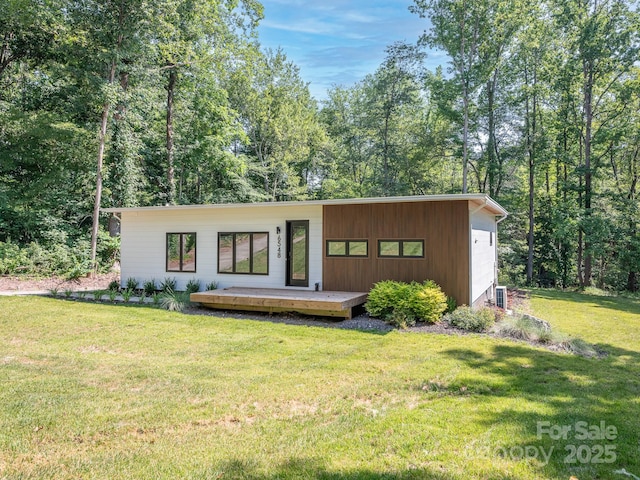6548 Emerald Isle Dr, Sherrills Ford, NC 28673 - view of front facade featuring a wooden deck, a front yard, and a garage