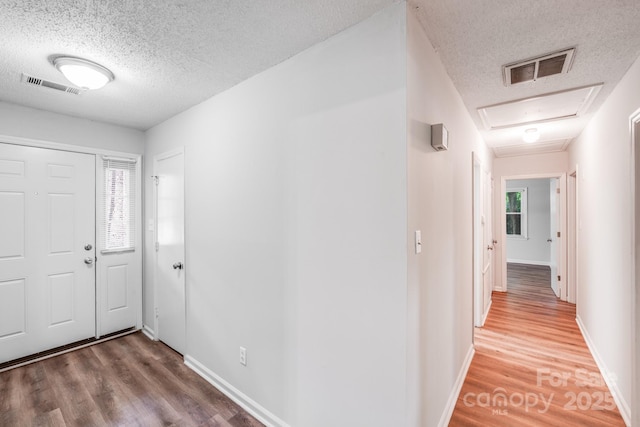 6513 Old Post Rd, Charlotte, NC 28212 - foyer featuring a textured ceiling, wood finished floors, and healthy amount of natural light