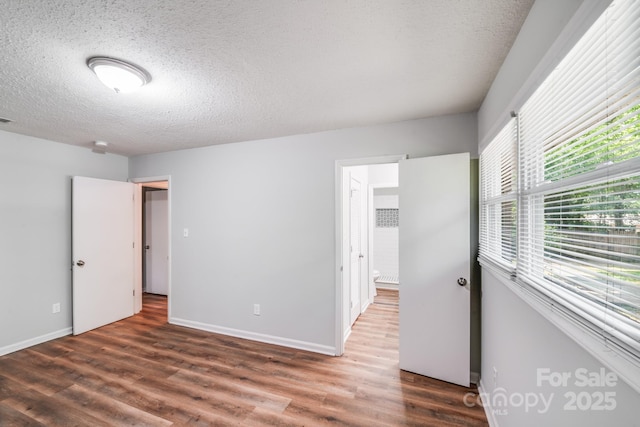 6513 Old Post Rd, Charlotte, NC 28212 - unfurnished bedroom with wood finished floors and a textured ceiling