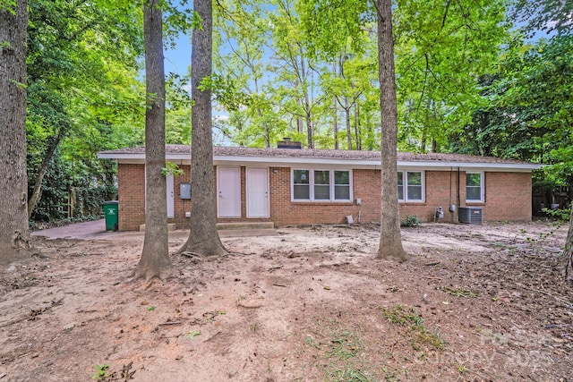 6513 Old Post Rd, Charlotte, NC 28212 - view of front of property featuring brick siding, entry steps, and a chimney