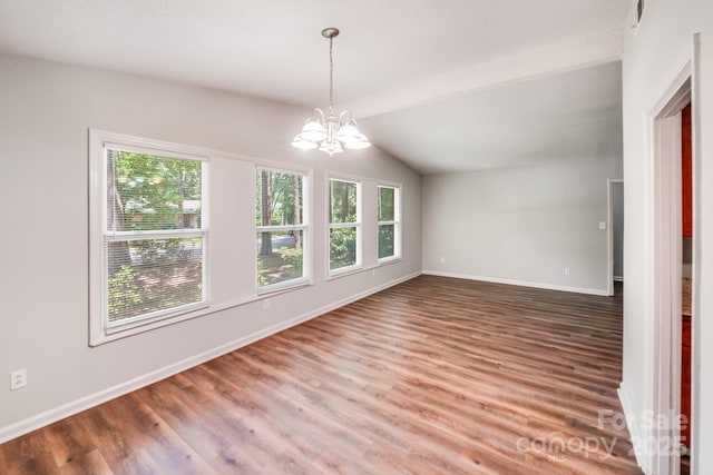 6513 Old Post Rd, Charlotte, NC 28212 - unfurnished room with a chandelier, wood finished floors, and vaulted ceiling