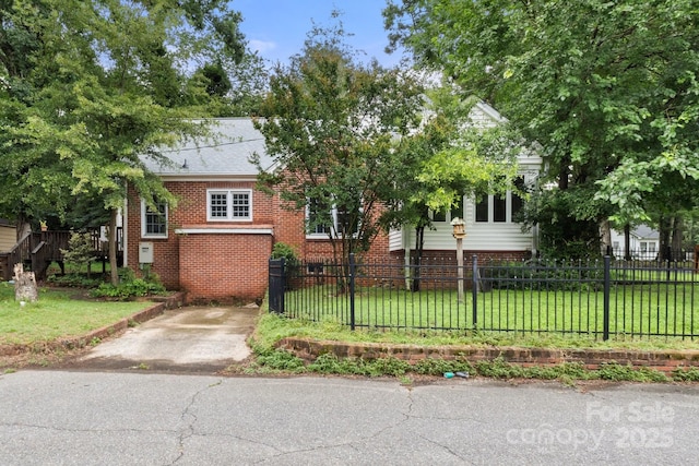 728 Blanton St, Shelby, NC 28150 - obstructed view of property featuring a fenced front yard and brick siding