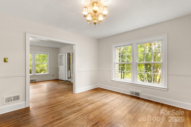 728 Blanton St, Shelby, NC 28150 - spare room with wood-type flooring and a chandelier