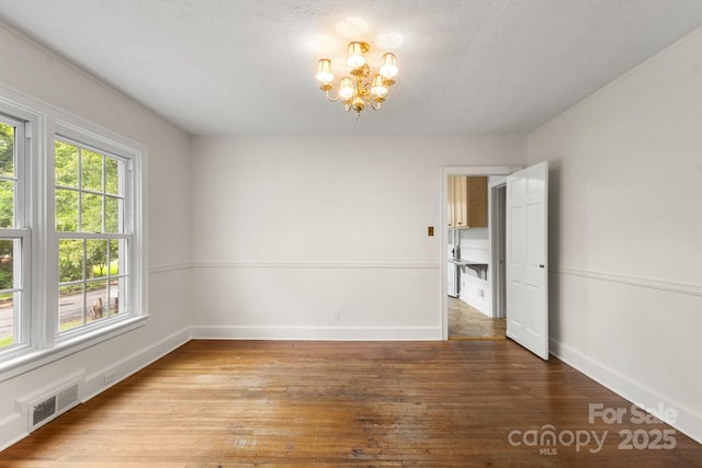 728 Blanton St, Shelby, NC 28150 - empty room featuring a chandelier and wood-type flooring