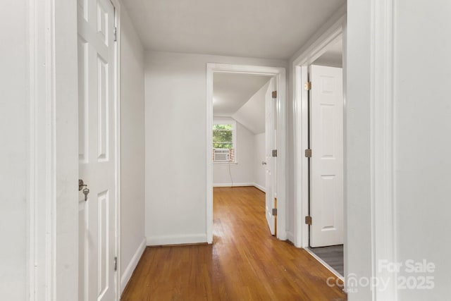 728 Blanton St, Shelby, NC 28150 - hallway with wood finished floors, lofted ceiling, and cooling unit