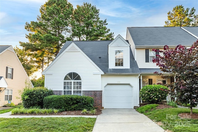11531 Delores Ferguson Ln, Charlotte, NC 28277 - view of front of house featuring driveway, a garage, roof with shingles, and brick siding