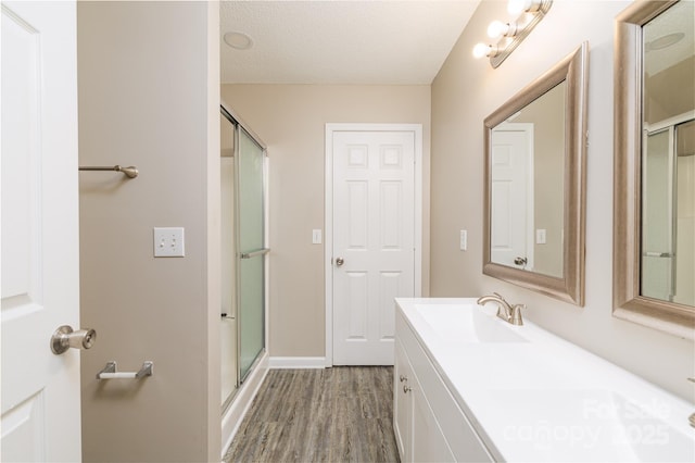 11531 Delores Ferguson Ln, Charlotte, NC 28277 - full bathroom featuring vanity, wood finished floors, and a shower with shower door