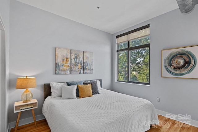514 W 10th St Unit 302, Charlotte, NC 28202 - bedroom with wood finished floors